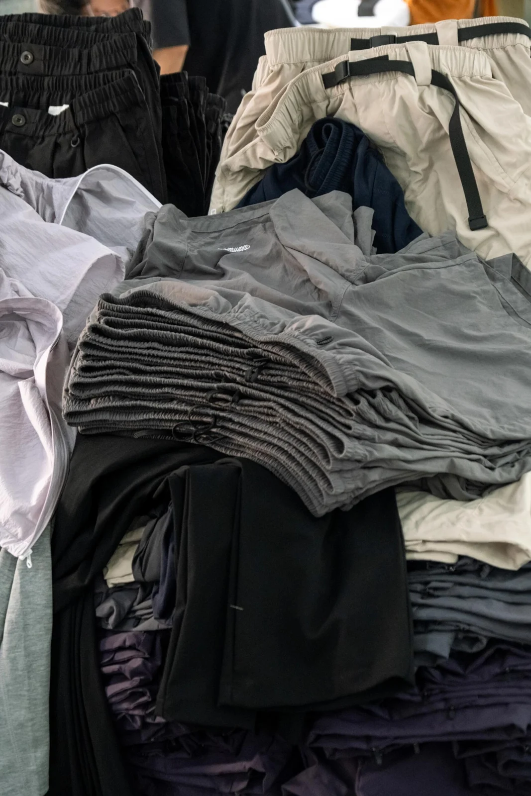 Stacks of cut fabric components in the workshop.