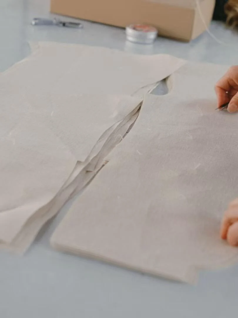 Paper pattern pieces on a worktable.