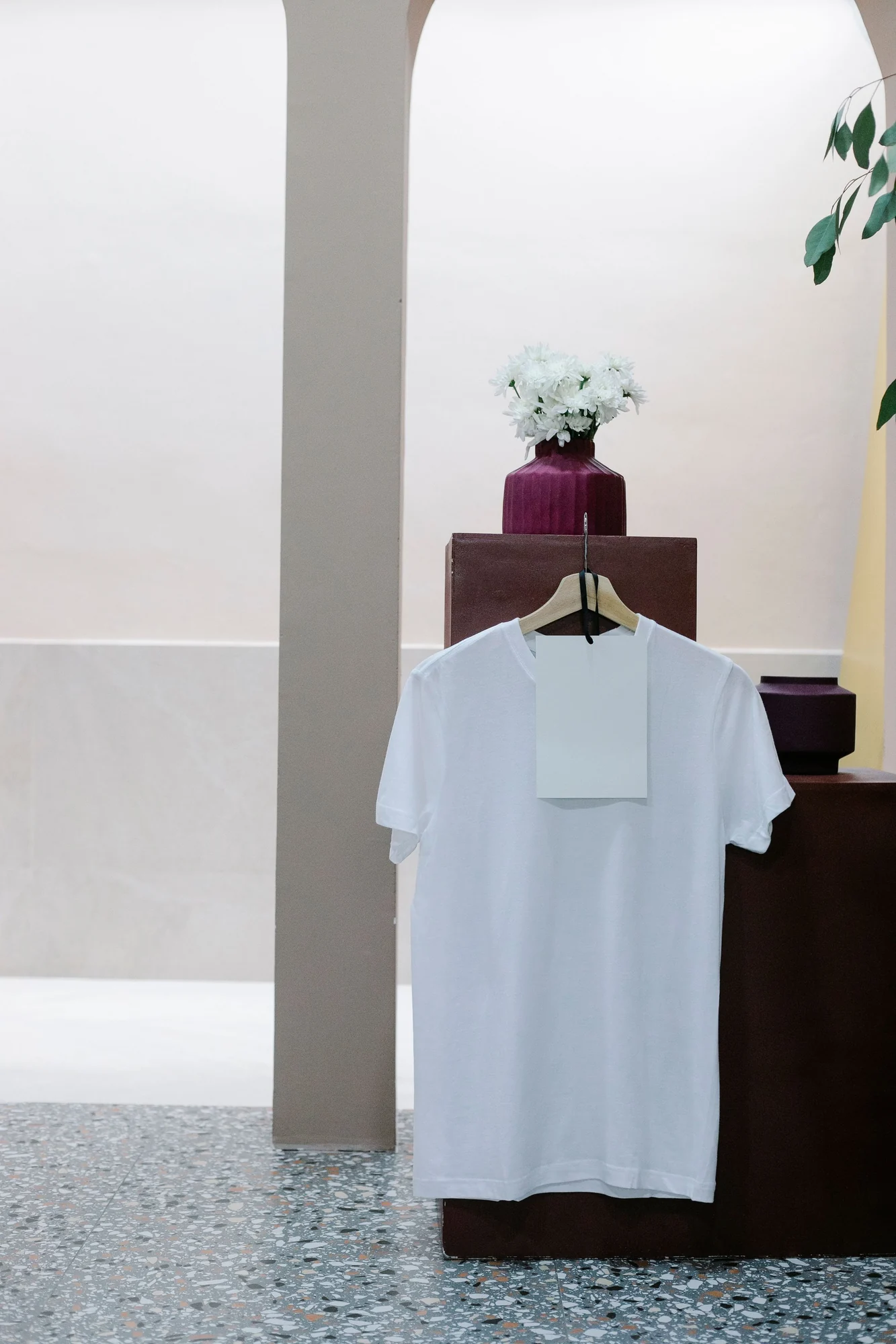 Plain white T-shirt with a blank hanging card.